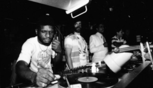 Larry Levan rocking a monophone at the Paradise Garage with David Mancuso (center) and Herbie Hancock (right). Photo credit: Gail Bruesewitz